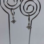 Aretes de formas plateado de estrella mayor
